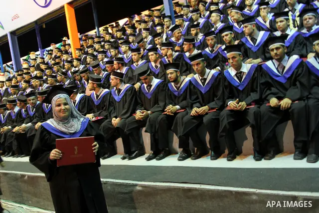 Palestinian students participate in their graduation ceremony at the University College of Applied Sciences in Gaza city on July18, 2011. Photo by Mohammed Asad