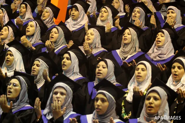 Palestinian students participate in their graduation ceremony at the University College of Applied Sciences in Gaza city on July18, 2011. Photo by Mohammed Asad