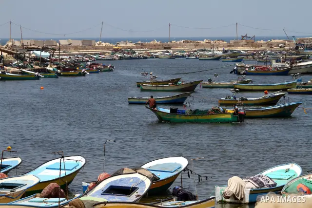 Palestinian fishermen ride a boat at the Gaza seaport on July 19, 2011. The Israeli navy on Tuesday boarded a French yacht carrying pro-Palestinian activists intending to sail to the blockaded Gaza Strip and forced it to...