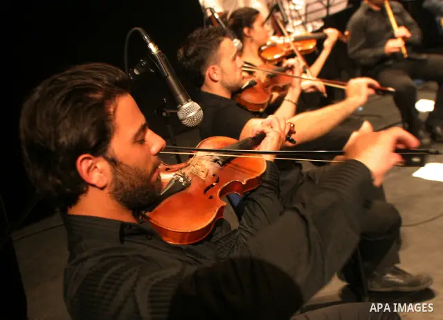 Palestinians perform during a musical concert at Al-Hakawati theatre in Jerusalem on July 19,2011. Photo by Mahfouz Abu Turk