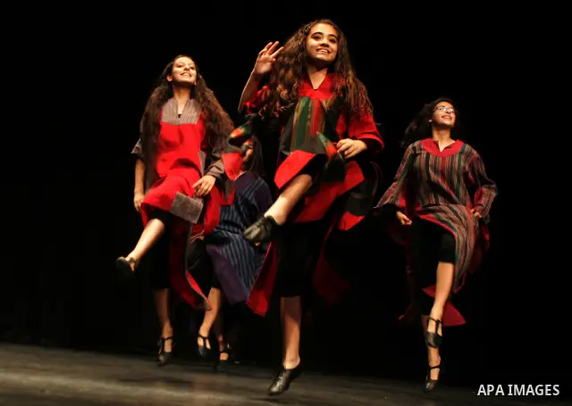 Palestinian children dance the traditional Dabka during a musical concert at Al-Hakawati theatre in Jerusalem on July 19,2011. Photo by Mahfouz Abu Turk