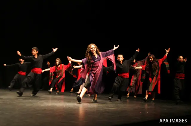 Palestinian children dance the traditional Dabka during a musical concert at Al-Hakawati theatre in Jerusalem on July 19,2011. Photo by Mahfouz Abu Turk