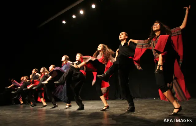 Palestinian children dance the traditional Dabka during a musical concert at Al-Hakawati theatre in Jerusalem on July 19,2011. Photo by Mahfouz Abu Turk