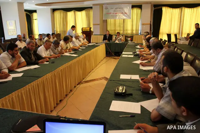 Palestinian Hamas department of Refugees members participate in a meeting to discuss the work of UNRWA in the Gaza Strip, Gaza city on July 19, 2011. Photo by Mohammed Asad
