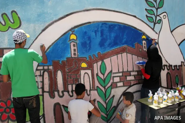 Palestinians participate in the International Conference to develop the centers of the historical cities and develop their economical situation, in the West Bank city of Hebron on July 19,2011. Photo by Najeh Hashlamoun