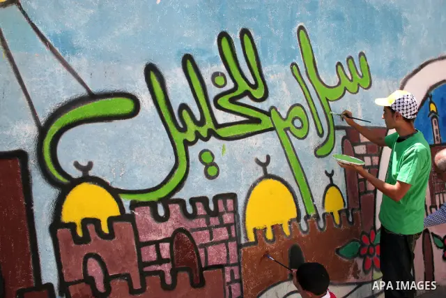 Palestinians participate in the International Conference to develop the centers of the historical cities and develop their economical situation, in the West Bank city of Hebron on July 19,2011. Photo by Najeh Hashlamoun