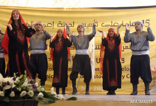 Palestinians participate in the International Conference to develop the centers of the historical cities and develop their economical situation, in the West Bank city of Hebron on July 19,2011. Photo by Najeh Hashlamoun