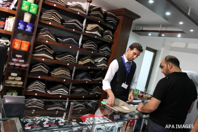 Palestinian shoppers crowd the inside of the shopping mall's new 'Andalusia'. Everything from household goods and food to clothing and shoes are available at the new shopping location in Gaza city on July 19, 2011 . Phot...
