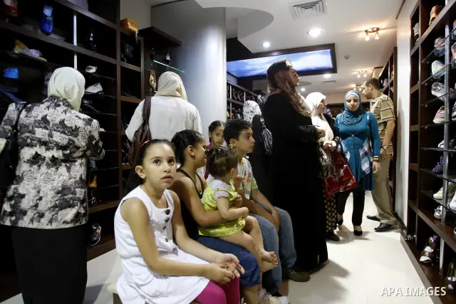 Palestinians shop at a newly open mall in Gaza city on July 19,2011. Photo by Mahmud Nassar