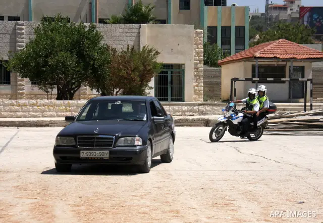 An EU policeman trains Palestinian policemen to organise the traffic in the West Bank city of Salfit on July 20,2011. . Photo by Wagdi Eshtayah