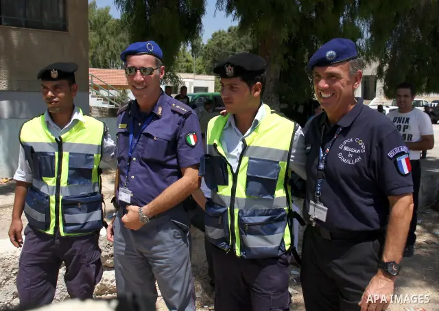An EU policeman trains Palestinian policemen to organise the traffic in the West Bank city of Salfit on July 20,2011. . Photo by Wagdi Eshtayah