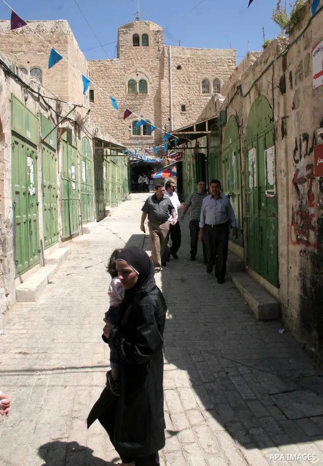 Palestinians enjoy the restoration places in the old city of Hebron on July 20,2011, as Palestinians participate in the second day of the International Conference to develop the centers of the historical cities and devel...