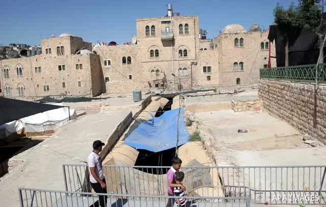 Palestinians enjoy the restoration places in the old city of Hebron on July 20,2011, as Palestinians participate in the second day of the International Conference to develop the centers of the historical cities and devel...