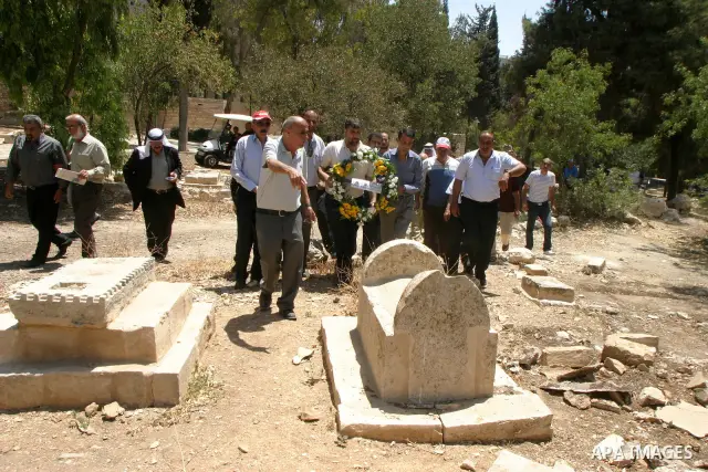 Palestinians take a part in a protest to the Israeli violations of the Islamic sanctities in Jerusalem on July 21, 2011. where washed away and destroyed lately about 100 grave in "Maaman allah" the historic Islamic grave...
