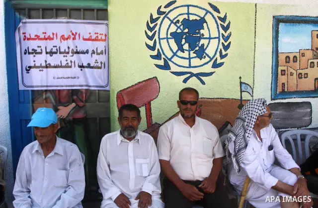 Palestinians take part during a protest infront of the UNRWA headquarters against the UNRWA decision to change its name and Reduce aid in Gaza city on July 21, 2011. Photo by Ashraf Amra
