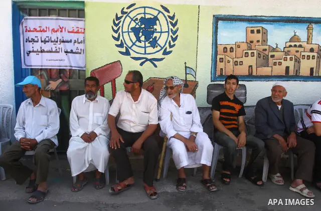 Palestinians take part during a protest infront of the UNRWA headquarters against the UNRWA decision to change its name and Reduce aid in Gaza city on July 21, 2011. Photo by Ashraf Amra