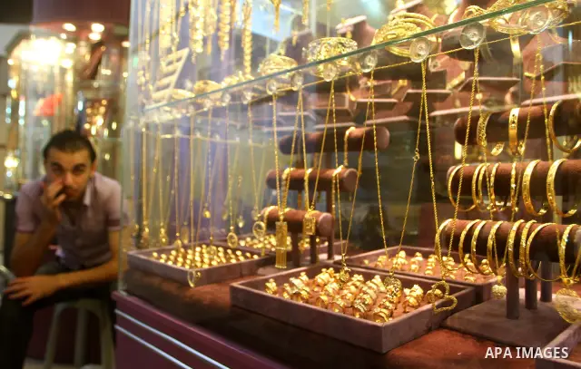 A Palestinian vendor sits in his jewellery store in Gaza city on 21 July 2011, and says that the one gold ounce cost 1650 US dollars at the local market which is and all time high for the market. Photo by Ashraf Amra