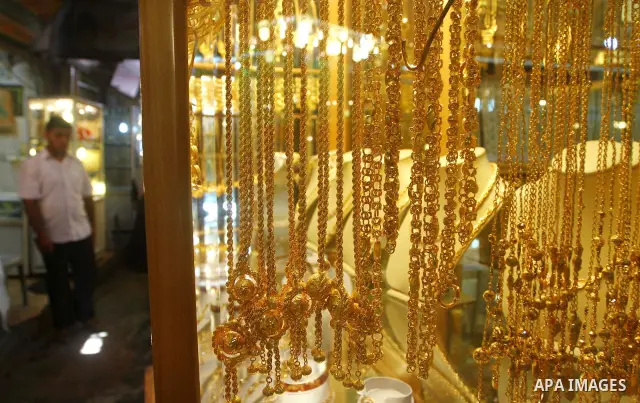 A Palestinian vendor stands infront of his jewellery store in Gaza city on 21 July 2011, and he says that the one gold ounce cost 1650 US dollars at the local market which is and all time high for the market. Photo by As...