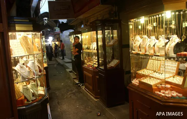 A Palestinian vendor stands infront of his jewellery store in Gaza city on 21 July 2011, and he says that the one gold ounce cost 1650 US dollars at the local market which is and all time high for the market. Photo by As...