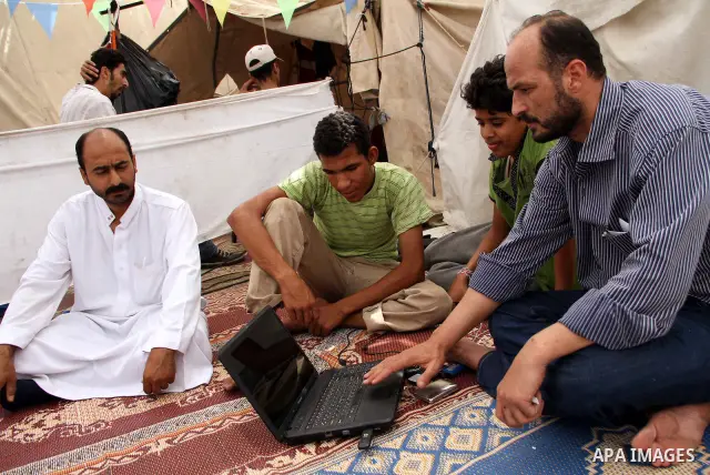 Egyptian protesters sit inside a makeshift tent after Friday prayers at Tahrir square in Cairo July 22, 2011. Egypt's prime minister promised on Thursday to set up an anti-corruption body and work to end a 30-year-emerge...