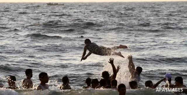 Palestinians cool off on the beach in Gaza City Friday, July 22, 2011. Photo by Mohammed Asad