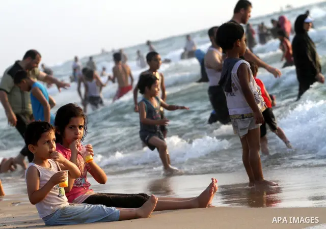 Palestinians cool off on the beach in Gaza City Friday, July 22, 2011. Photo by Mohammed Asad
