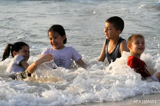 Palestinians cool off on the beach in Gaza City Friday, July 22, 2011. Photo by Mohammed Asad