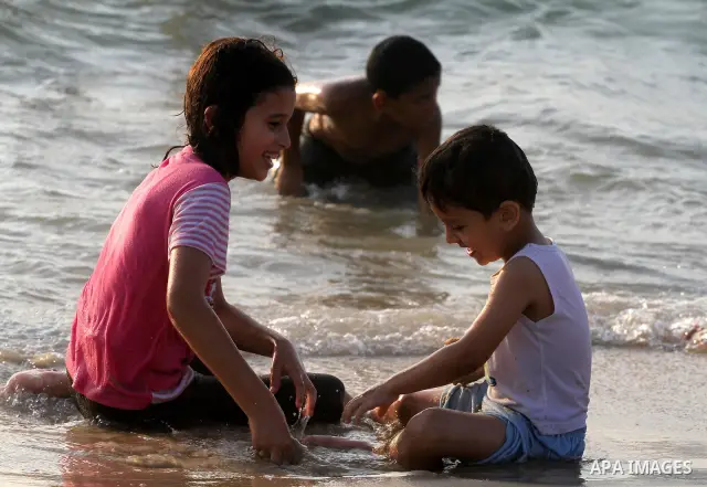 Palestinians cool off on the beach in Gaza City Friday, July 22, 2011. Photo by Mohammed Asad