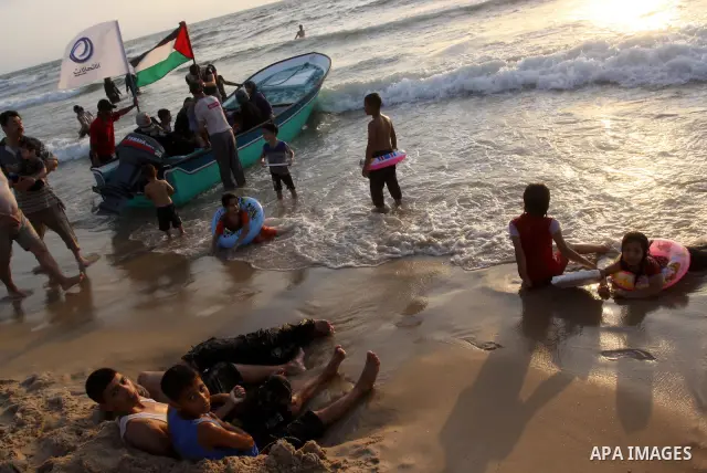 Palestinians cool off on the beach in Gaza City Friday, July 22, 2011. Photo by Mohammed Asad