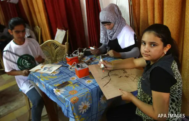 Palestinian girls enjoy at a summer camp and performing handicrafts in Gaza City on July 23, 2011. Photo by Ashraf Amra