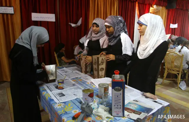 Palestinian girls enjoy at a summer camp and performing handicrafts in Gaza City on July 23, 2011. Photo by Ashraf Amra