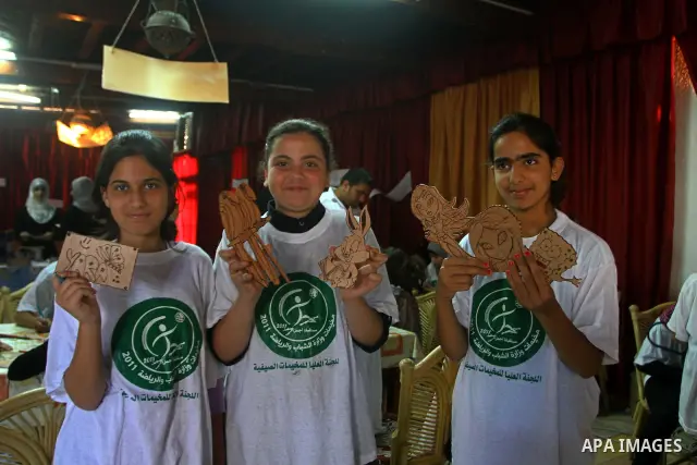 Palestinian girls enjoy at a summer camp and performing handicrafts in Gaza City on July 23, 2011. Photo by Ashraf Amra