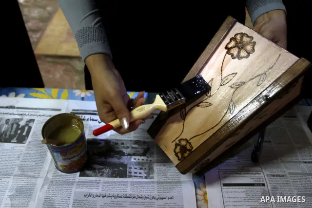 A Palestinian girl enjoys at a summer camp and performing handicrafts in Gaza City on July 23, 2011. Photo by Ashraf Amra