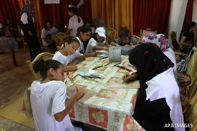 Palestinian girls enjoy at a summer camp and performing handicrafts in Gaza City on July 23, 2011. Photo by Ashraf Amra