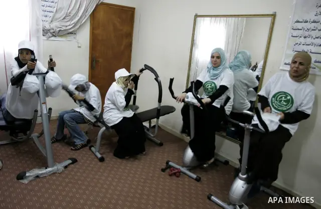 Palestinian women participate in a summer camp organised by the Ministry of Youth and Sports in the southern Gaza Strip town of Rafah on July 23,2011. Photo by Abed Rahim Khatib