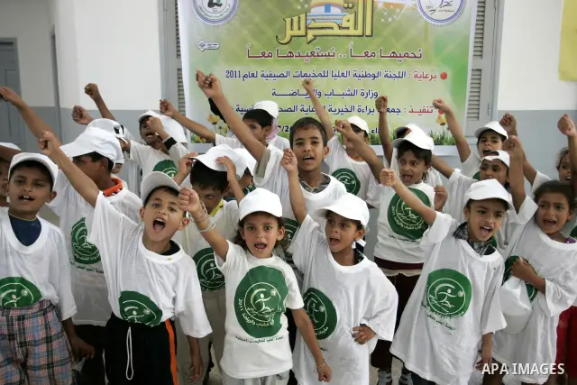 Palestinian children participate in a summer camp organised by the Ministry of Youth and Sports in the southern Gaza Strip town of Rafah on July 23,2011. Photo by Abed Rahim Khatib