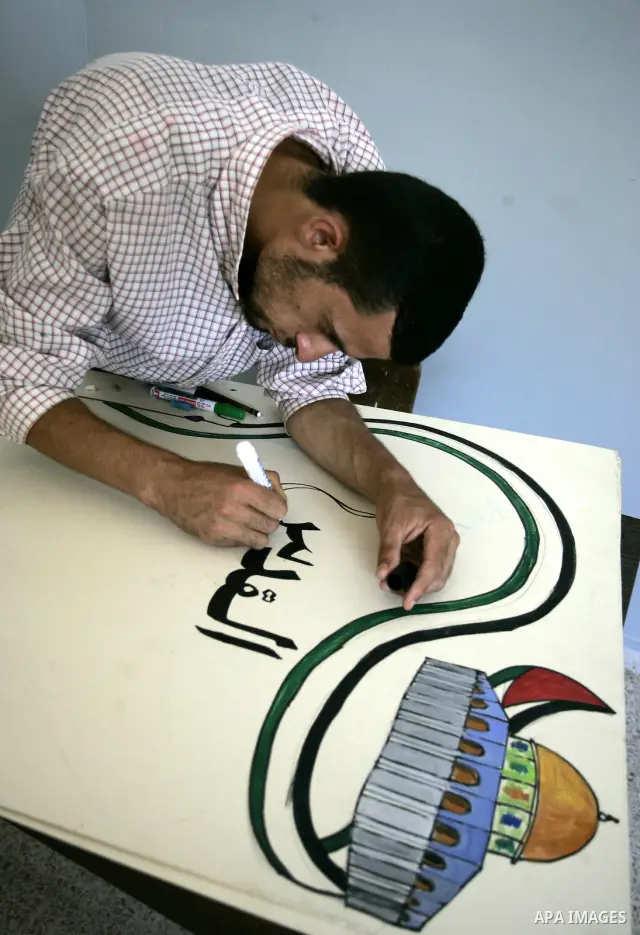 A Palestinian youth participates in a summer camp organised by the Ministry of Youth and Sports in the southern Gaza Strip town of Rafah on July 23,2011. Photo by Abed Rahim Khatib