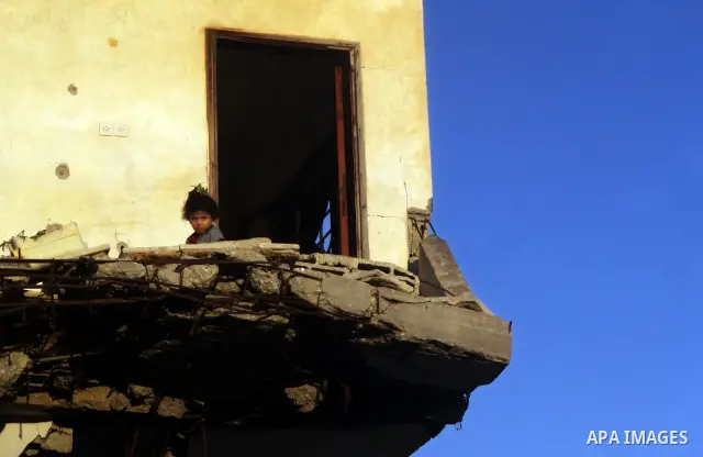 A Palestinian child plays inside her family destroyed house in Jabaliya refugee camp, in the northern Gaza Strip on 23 July 2011 house was destroyed during the Israeli assault on Gaza in late 2008 to early 2009, and beca...