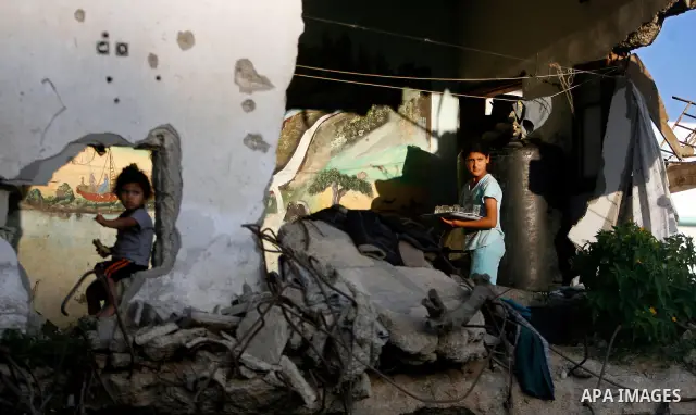 Palestinian children play inside their family destroyed house in Jabaliya refugee camp, in the northern Gaza Strip on 23 July 2011 house was destroyed during the Israeli assault on Gaza in late 2008 to early 2009, and be...