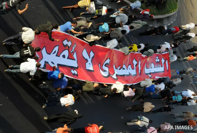 Egyptian protesters march towards the defence ministry, the headquarters of the Supreme Council of the Armed Forces, in Cairo on July 23, 2011 to show their anger at the ruling military's handling of the transition from...