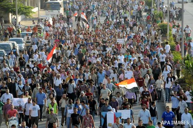 Egyptian protesters march towards the defence ministry, the headquarters of the Supreme Council of the Armed Forces, in Cairo on July 23, 2011 to show their anger at the ruling military's handling of the transition from...