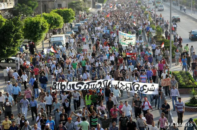 Egyptian protesters march towards the defence ministry, the headquarters of the Supreme Council of the Armed Forces, in Cairo on July 23, 2011 to show their anger at the ruling military's handling of the transition from...