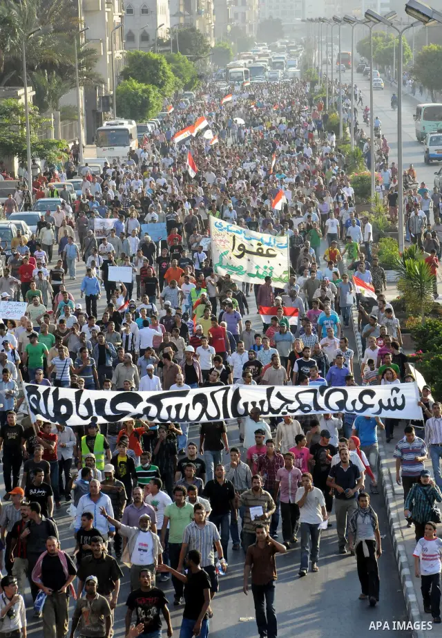 Egyptian protesters march towards the defence ministry, the headquarters of the Supreme Council of the Armed Forces, in Cairo on July 23, 2011 to show their anger at the ruling military's handling of the transition from...