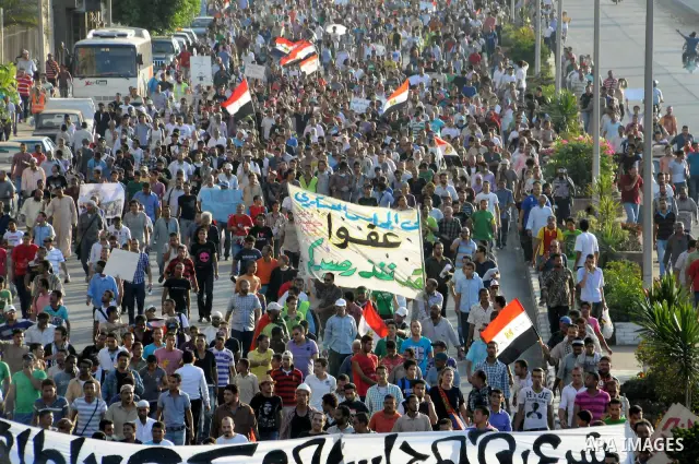 Egyptian protesters march towards the defence ministry, the headquarters of the Supreme Council of the Armed Forces, in Cairo on July 23, 2011 to show their anger at the ruling military's handling of the transition from...
