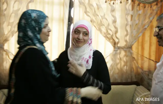 Hadeel Jamal Jaber, a Palestinian secondary school student and the winner of the fourth level in Palestine celebrates with her family in Gaza city on July 24, 2011. Photo by Abed Rahim Khatib
