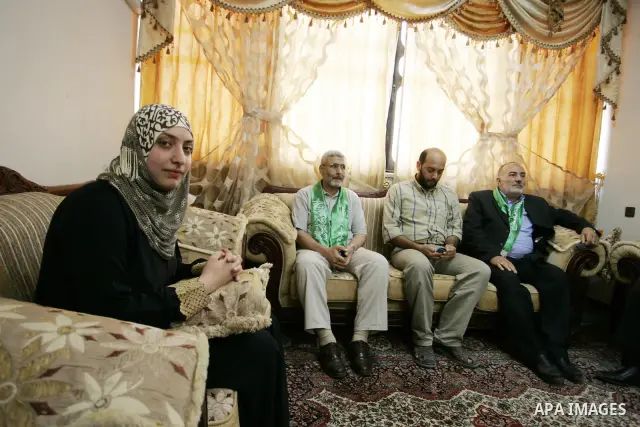 Hadeel Jamal Jaber, a Palestinian secondary school student and the winner of the fourth level in Palestine celebrates with her family in Gaza city on July 24, 2011. Photo by Abed Rahim Khatib
