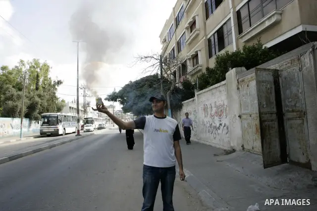 A Palestinian man celebrates after the results of high school exams, or "Tawjihe", in in Gaza city on July 24, 2011. The Ministry of Education in Gaza Strip and the West Bank announced the results together. Photo by Abed...