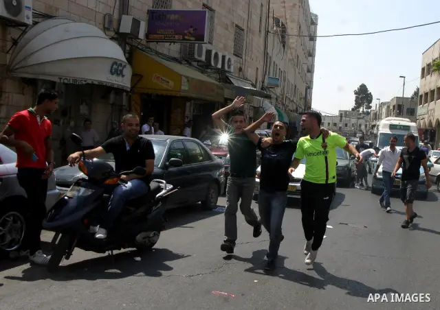 Palestinian students celebrate after they received their results of final high school exams, known as "Tawjihi" in Jerusalem's old city on July 24,2011.. Photo by Mahfouz Abu Turk