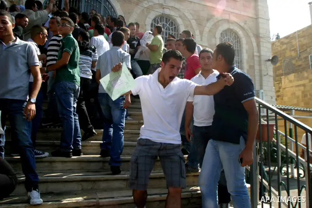 Palestinian students celebrate after they received their results of final high school exams, known as "Tawjihi" in Jerusalem's old city on July 24,2011.. Photo by Mahfouz Abu Turk