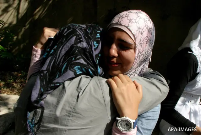 Palestinian students celebrate after they received their results of final high school exams, known as "Tawjihi" in Jerusalem's old city on July 24,2011.. Photo by Mahfouz Abu Turk